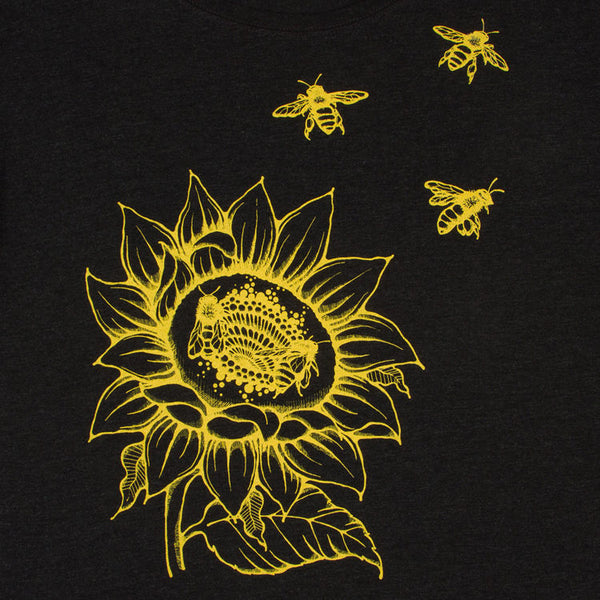 Sunflower & Honey Bees Women's T-shirt. Start wearing your new favorite shirt now. Soft, modern and original.   Super soft triblend material in vintage black, flower and bees printed in gold yellow.  Preshrunk, true to size dolman.  FREE package of wildflower seeds with your order. Help provide nectar, pollen and shelter to our beloved pollinators.  We Love Bees!!