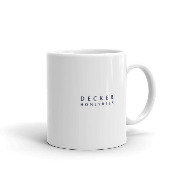Decker Honeybees Magnolia Mug. Whether you're drinking your morning coffee, your evening tea, or something in between – this mug's for you! It's sturdy and glossy with our new original design. Just add honey! Ceramic. Dishwasher and microwave safe. White and glossy