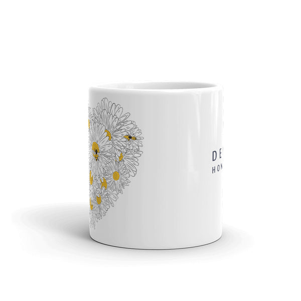 Decker Honeybees Daisy Heart Mug. Whether you're drinking your morning coffee, your evening tea, or something in between – this mug's for you! It's sturdy and glossy with beautiful original art that'll withstand the microwave and dishwasher. Just add honey! Ceramic. Dishwasher and microwave safe. White and glossy