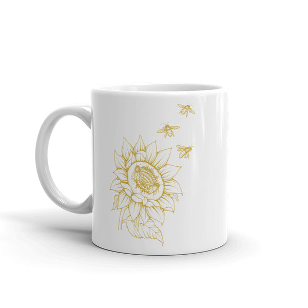 Decker Honeybees Sunflower Mug. Whether you're drinking your morning coffee, your evening tea, or something in between – this mug's for you! It's sturdy and glossy with beuatiful original art that'll withstand the microwave and dishwasher. Ceramic. Dishwasher and microwave safe. White and glossy