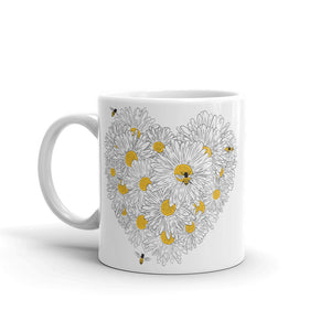 Decker Honeybees Daisy Heart Mug. Whether you're drinking your morning coffee, your evening tea, or something in between – this mug's for you! It's sturdy and glossy with beautiful original art that'll withstand the microwave and dishwasher. Just add honey! Ceramic. Dishwasher and microwave safe. White and glossy