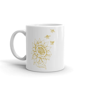 Decker Honeybees Sunflower Mug. Whether you're drinking your morning coffee, your evening tea, or something in between – this mug's for you! It's sturdy and glossy with beuatiful original art that'll withstand the microwave and dishwasher. Ceramic. Dishwasher and microwave safe. White and glossy